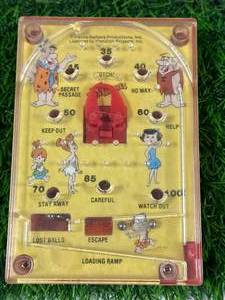 lot 31 image: Vintage Flintstones Handheld Pinball Game