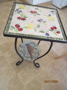 lot 129 image: Wrought Iron outdoor table with dec...