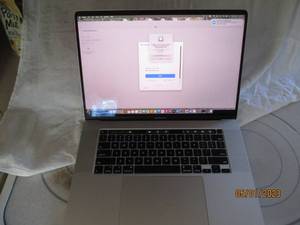 lot 265 image: Apple MacBook Pro with power cord...