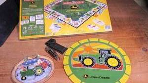 lot 280 image: John deer monopoly, wall hanging an...