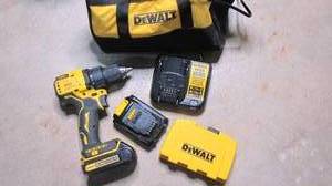 lot 306 image: Dewalt 20v drill with charger and e...