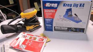 lot 318 image: Dewalt palm sander and kreg jig...
