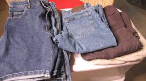 lot 344 image: duffle bag full of jeans 38x 42 and...