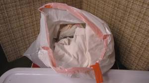 lot 345 image: huge tote full of bedspreads and ot...