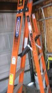 lot 13 image: Werner ladder. 300 lb podium...