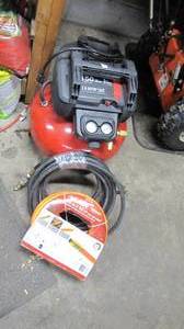 lot 18 image: air compressor with 2 hoses...