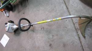 lot 19 image: still weed whip....