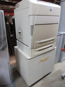 lot 133 image: HP COLOR LASER JET PRINTER WITH STORAGE STAND