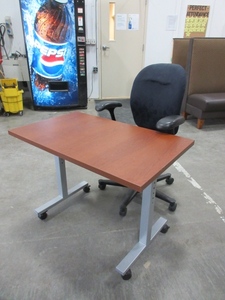 lot 222 image: ROLLING WORK TABLE AND HERMAN MILLER AMBI CHAIR
