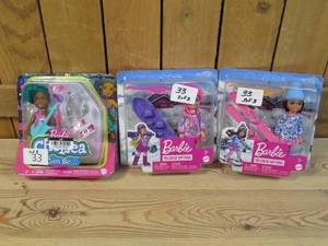 lot 33 image: Lot of THREE Barbies