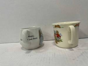 lot 103 image: Lot of 2 ceramic Peter Rabbit cups
