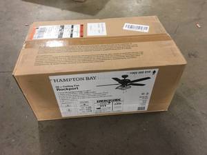 lot 40 image: Rockport 52 in. Indoor LED Matte Black Ceiling Fan with Light Kit, Downrod, and 5 Reversible Blades by Hampton Bay   Customer Returns See Pictures