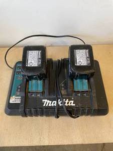 lot 38 image: Makita Charger deck with 2 batteries.