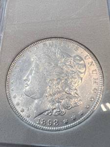 1898 US MORGAN SILVER DOLLAR IN PLASTIC