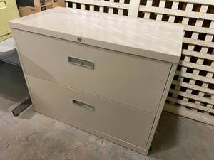 lot 6 image: Long Beige File Cabinet