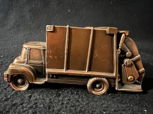 lot 93 image: Vintage Metal Dump Truck Bank, Cannon and Movie Guy