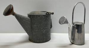 lot 132 image: Two Vintage Watering Cans 1 Aluminum 1 Galvanized