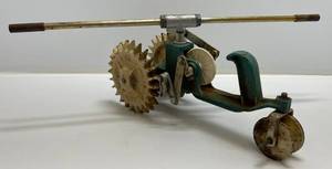lot 172 image: Vintage Sears Roebuck & Co. Cast Iron Walking Lawn Tractor Sprinkler