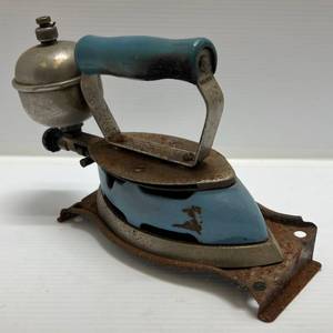 lot 174 image: Vintage Light Blue Coleman Steam Iron With Stand