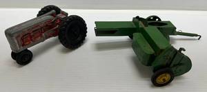 lot 183 image: Vintage Eska 116 John Deere 14T Hay Baler, Metal Teeth And Vintage Hubley Die-Cast Tractor (Missing Steering Wheel)