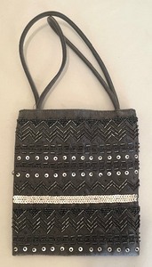 lot 142 image: Four Handbags