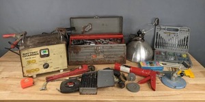 lot 110 image: Assorted Tools and Garage Items Sears Battery Charger, Work Lamp, Stud Finder, Tool Box and More R