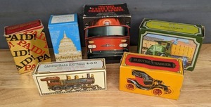 lot 108B image: (6) Vintage Avon Decorative Bottle After Shave Electric Charger, Cannonball Express 4-6-0, Stamp Decanter, The Capitol, The Red Sentinel and Big Mack Wind Jammer J