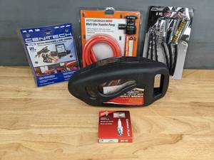 lot 306A image: Impact Wrench, New Champion Spark Plug, Transfer Pump and More  J
