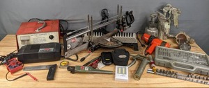lot 201 image: Assorted Handyman Items Socket Set, Christie Battery Charger, Grease Gun, Coleman Portable Air Compressor, Black & Decker Cordless Hot Glue Gun, Vintage Paint Guns, and More R
