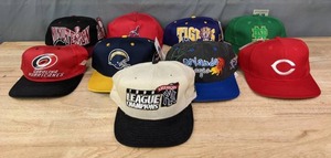 lot 122A image: Vintage 1998 New York Yankees League Champions Hat, San Diego Chargers NFL Hat, LSU Tigers Hat, Cincinnati Reds Hat, Orlando Magic Hat, Carolina Hurricanes Snapback Hat and More J