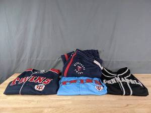 lot 234 image: Twins Jersey, Top, Sweats, and Minneapolis Jersey J