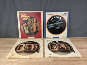 lot 277 image: (4) RCA SelectaVision Video Discs Walt Disney Productions The Apple Dumpling Gang, Walt Disney Productions The Black Hole and (2) Paramount Pictures Ordinary People R