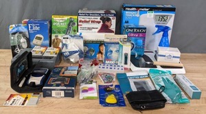 lot 261 image: Assortment of Night Light, Post-It Tape Flags, Finger Nail Clipper, Velcro Stick on Clock, Earwax Tool, One Touch Ultra, HealthoMeter Weight Tracking Scale, Thermapulse Relief Wrap, Hempvana Rocket Pain Relief Pen, Glucometer Elite and More R