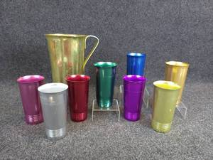 lot 503 image: Vintage Aluminum Color Craft Pitcher and (8) West Bend Aluminum Tumblers