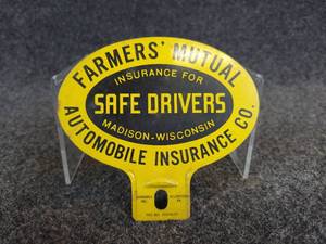 lot 569 image: Vintage Farmers Mutual Insurance License Plate Topper