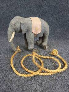 lot 533 image: Antique Plush Elephant Pull Toy on Cast Iron Wheels - Believed to be Steiff