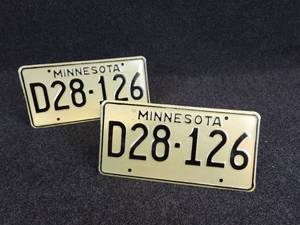 lot 540 image: Pair of Vintage Matched Minnesota Dealer License Plates - includes Original Envelope