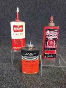 lot 559 image: Marvel Mystery Oil, Midland Fine Oil and J.C. Higgins Gun Oil Cans