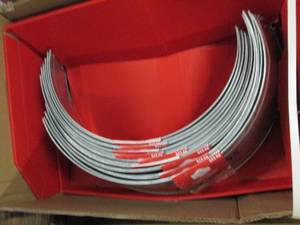 lot 191 image: box full of 27 inch metal tree coll...