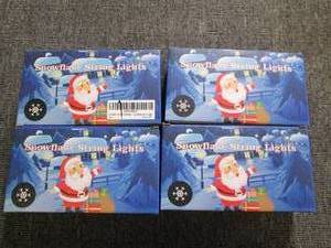 lot 199 image: 4 packages of snowflake string ligh...