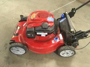 lot 14 image: Recycler 22 in. Personal Pace Variable Speed Gas Walk Behind Self Propelled Lawn Mower with Blade Stop System by Toro Customer Returns See Pictures