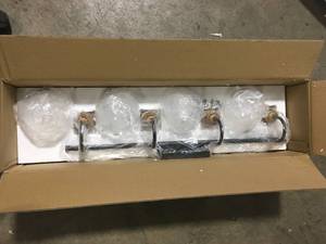lot 34 image: LNC Modern Black Wall Light 29.5 in. 4-Light Bronze and Antique Gold Bathroom Brass Vanity Light with Globe Glass Shades  Customer Returns See Pictures