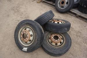 5 - Uniroyal and Laredo Brand Truck Tires On 80 Bolt Rims