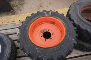 2 - Titan Brand Skid Loader Tires on 6 Bolt Rims