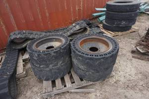 4 - Maxim Construction Pro Solid Skid Steer Tires On 8 Bolt Rims