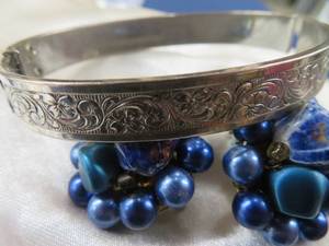 GORGEOUS SILVER BRACELET AND FUNKY CLIP ON EARINGS.