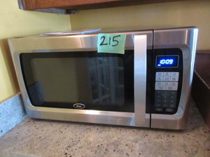 lot 215 image: OSTER STAINLESS STEEL MICROWAVE