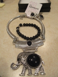 lot 128 image: BLACK AND SILVER TONE ELEPHANT NECKLACE, EARRINGS AND BRACELET - NEW