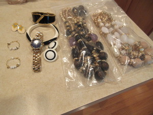 lot 139 image: CHARM WATCH AND BLACK,WHITE, GOLD COLORED JEWELRY
