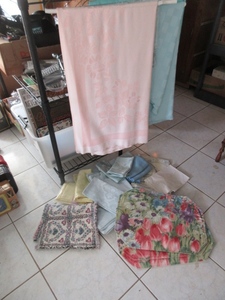lot 303 image: NICE QUALITY SPRING TABLE LINENS IN ASSORTED SHAPES AND COLORS.